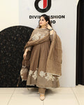 Elegant brown cotton suit set featuring beautiful floral prints, comfortable fabric, matching dupatta, and stylish ethnic appeal perfect for festive and casual wear.