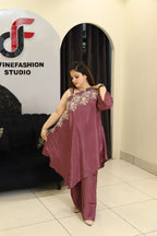 Woman in a floral embroidered co-ord set in a studio