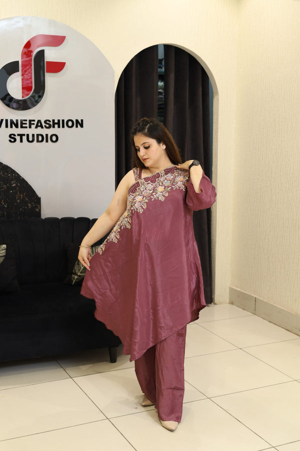 Woman in a floral embroidered co-ord set in a studio