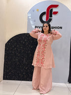 Woman in a pink floral embroidered button-down co-ord set
