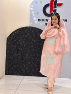 Woman in a pink floral embroidered button-down co-ord set