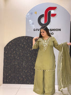 Woman in green floral embroidered button-down co-ord set