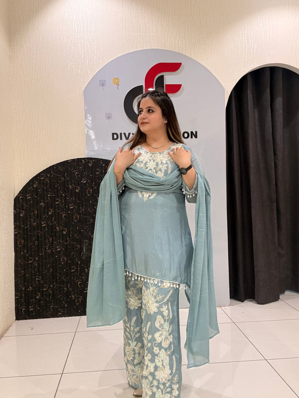 Graceful pastel blue crepe suit set featuring intricate hand embroidery and matching dupatta