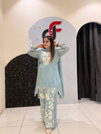 Graceful pastel blue crepe suit set featuring intricate hand embroidery and matching dupatta
