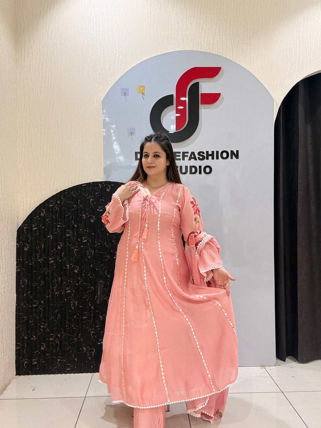 Graceful pink Mul Chanderi suit set featuring mirror work detailing and a floral embroidered dupatta