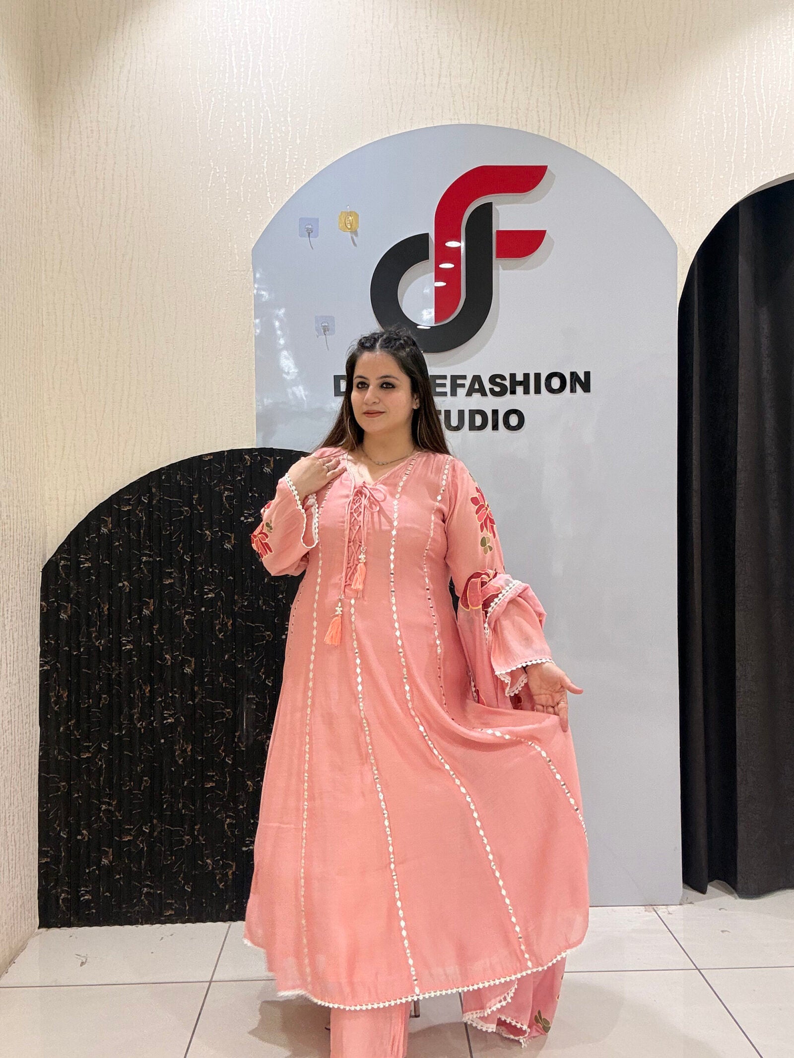 Graceful pink Mul Chanderi suit set featuring mirror work detailing and a floral embroidered dupatta