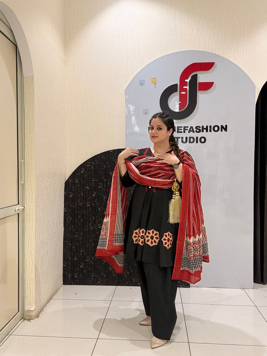 Elegant black pure cotton suit set featuring red and beige embroidery with a matching printed dupatta