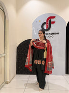 Elegant black pure cotton suit set featuring red and beige embroidery with a matching printed dupatta