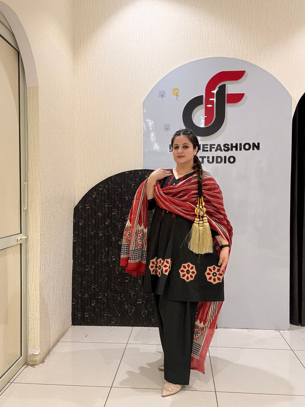 Elegant black pure cotton suit set featuring red and beige embroidery with a matching printed dupatta