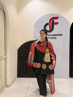 Elegant black pure cotton suit set featuring red and beige embroidery with a matching printed dupatta