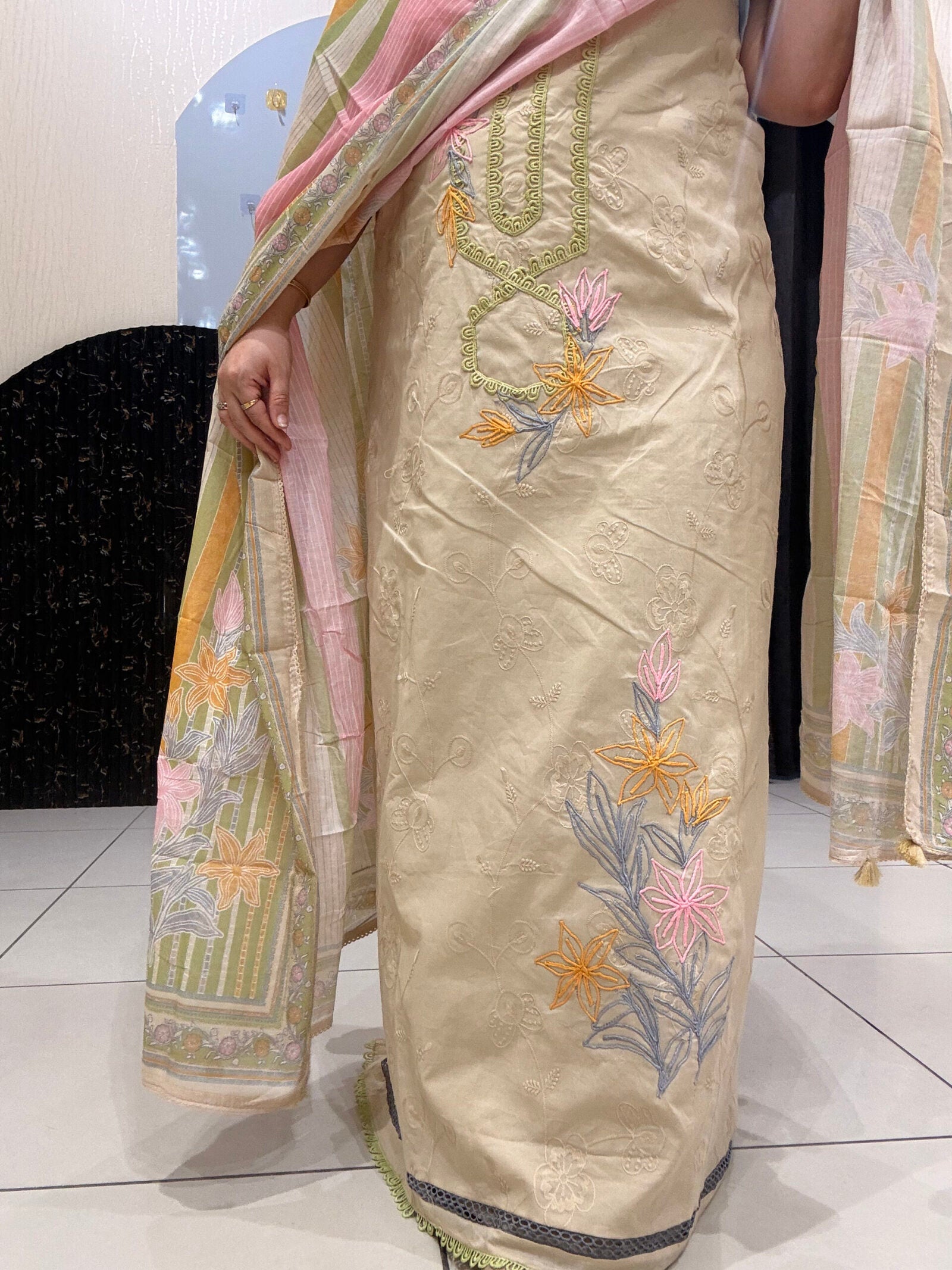 Elegant, unstitched cotton suits featuring delicate thread embroidery and pastel hues