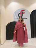 Graceful maroon pure cotton suit featuring delicate embroidery and a matching dupatta