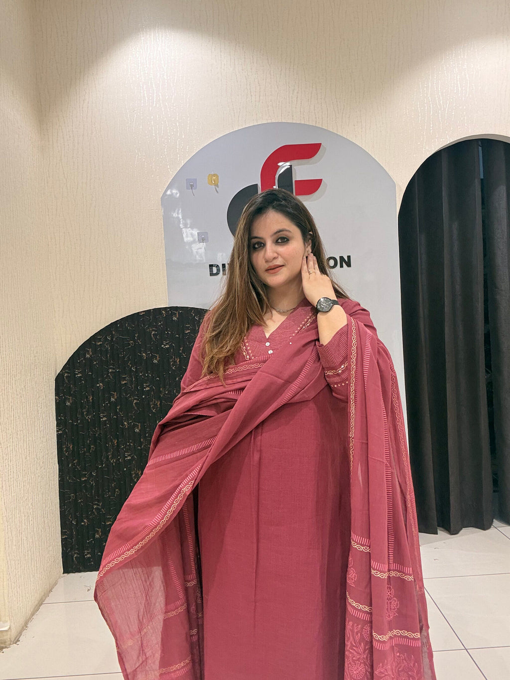 Graceful maroon pure cotton suit featuring delicate embroidery and a matching dupatta