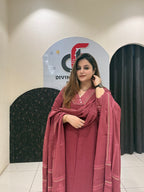 Graceful maroon pure cotton suit featuring delicate embroidery and a matching dupatta