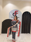 Elegant black Maslin suit featuring vibrant red and white prints with a matching dupatta