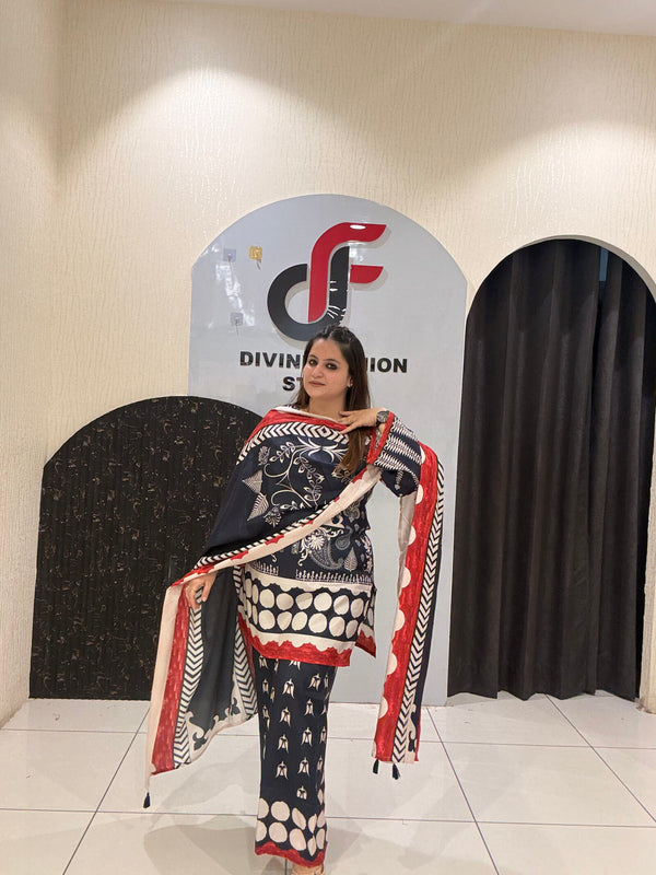 Elegant black Maslin suit featuring vibrant red and white prints with a matching dupatta