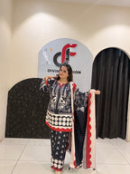 Elegant black Maslin suit featuring vibrant red and white prints with a matching dupatta