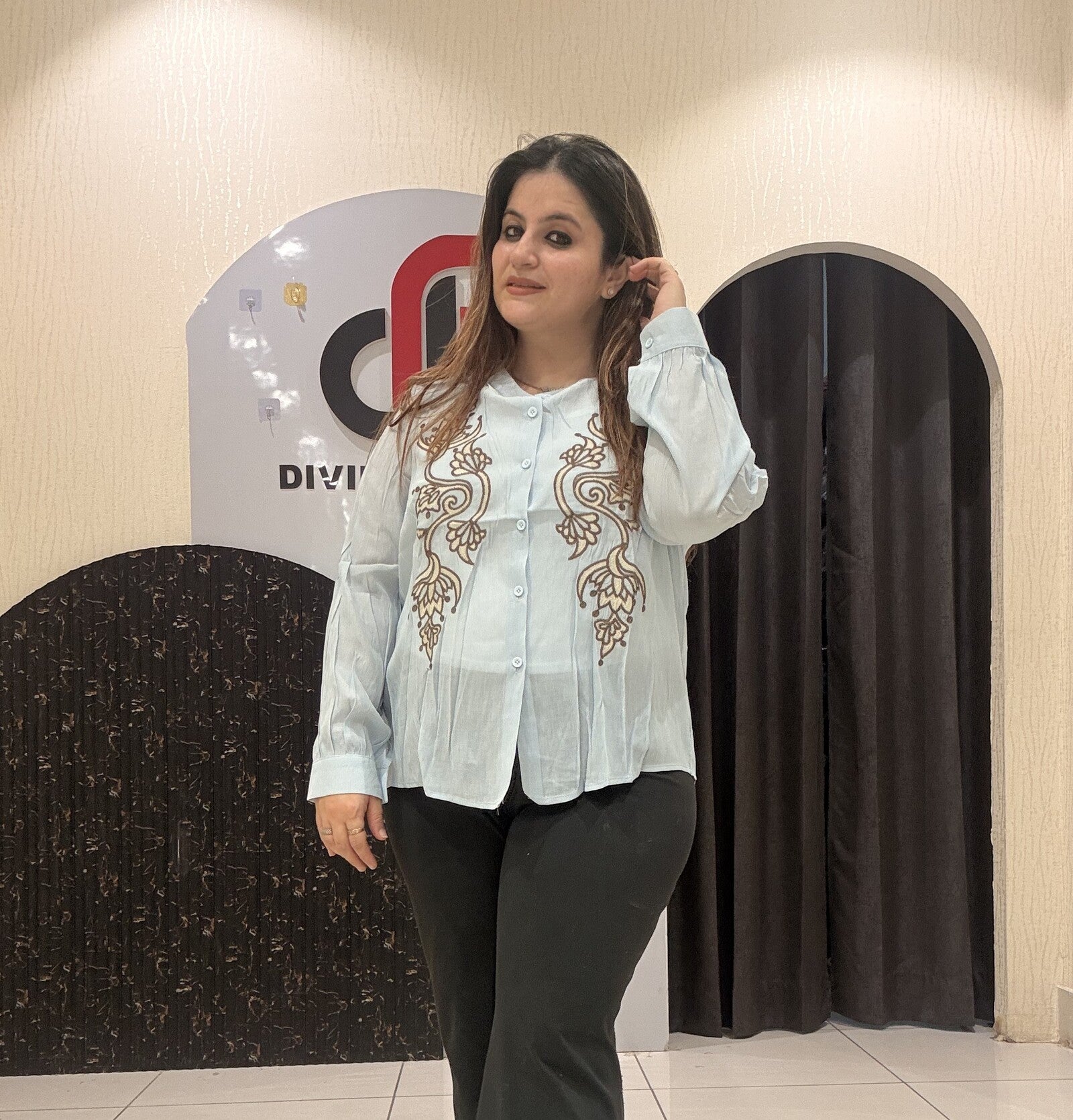 Stylish tops featuring intricate front embroidery and a classic button-up design