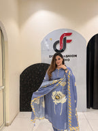 Graceful blue pure Maslin suit featuring large floral embroidery and a matching dupatta with striped borders