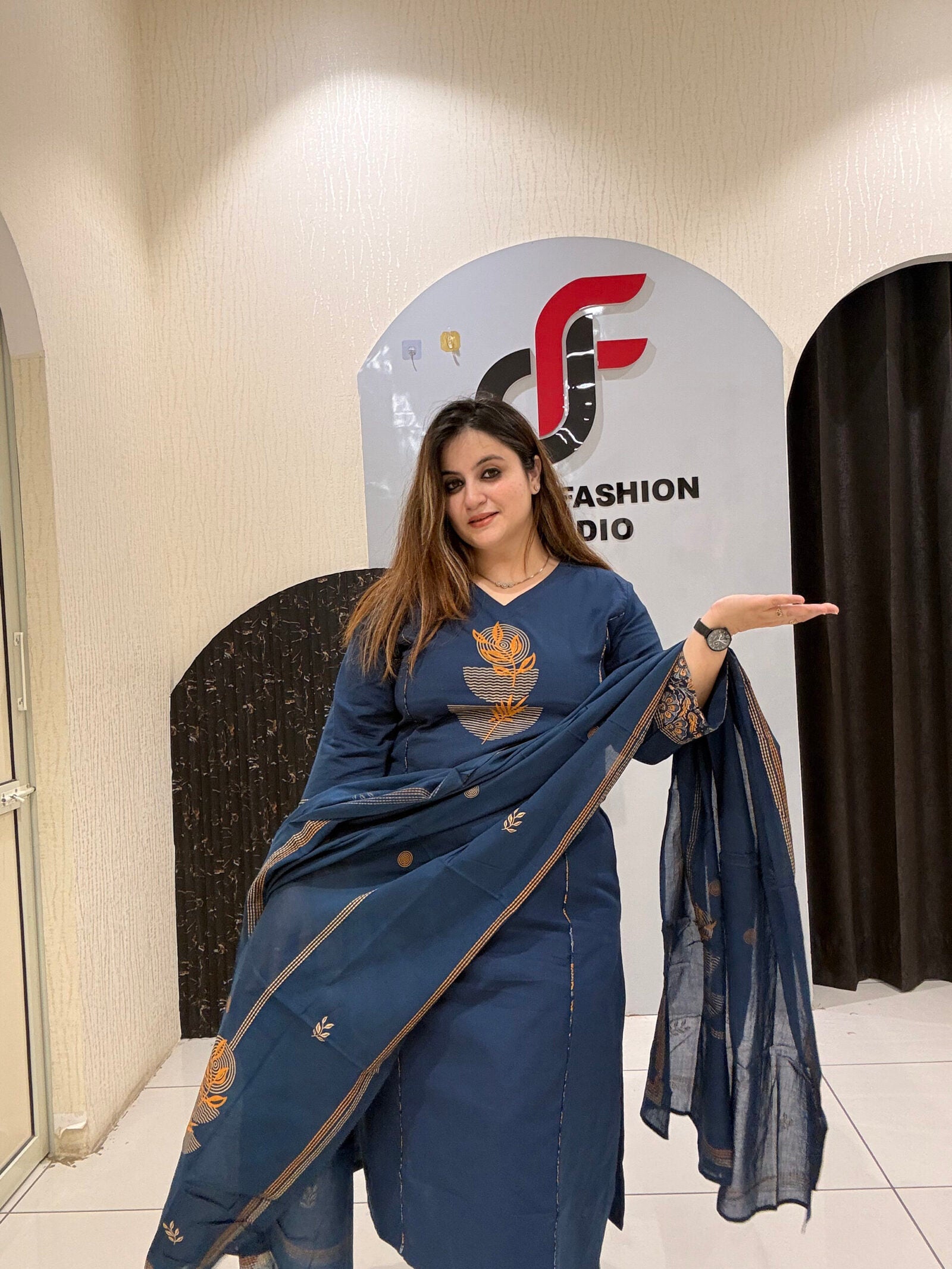Classic navy blue cotton suit featuring golden embroidery and a matching dupatta with delicate border detailing