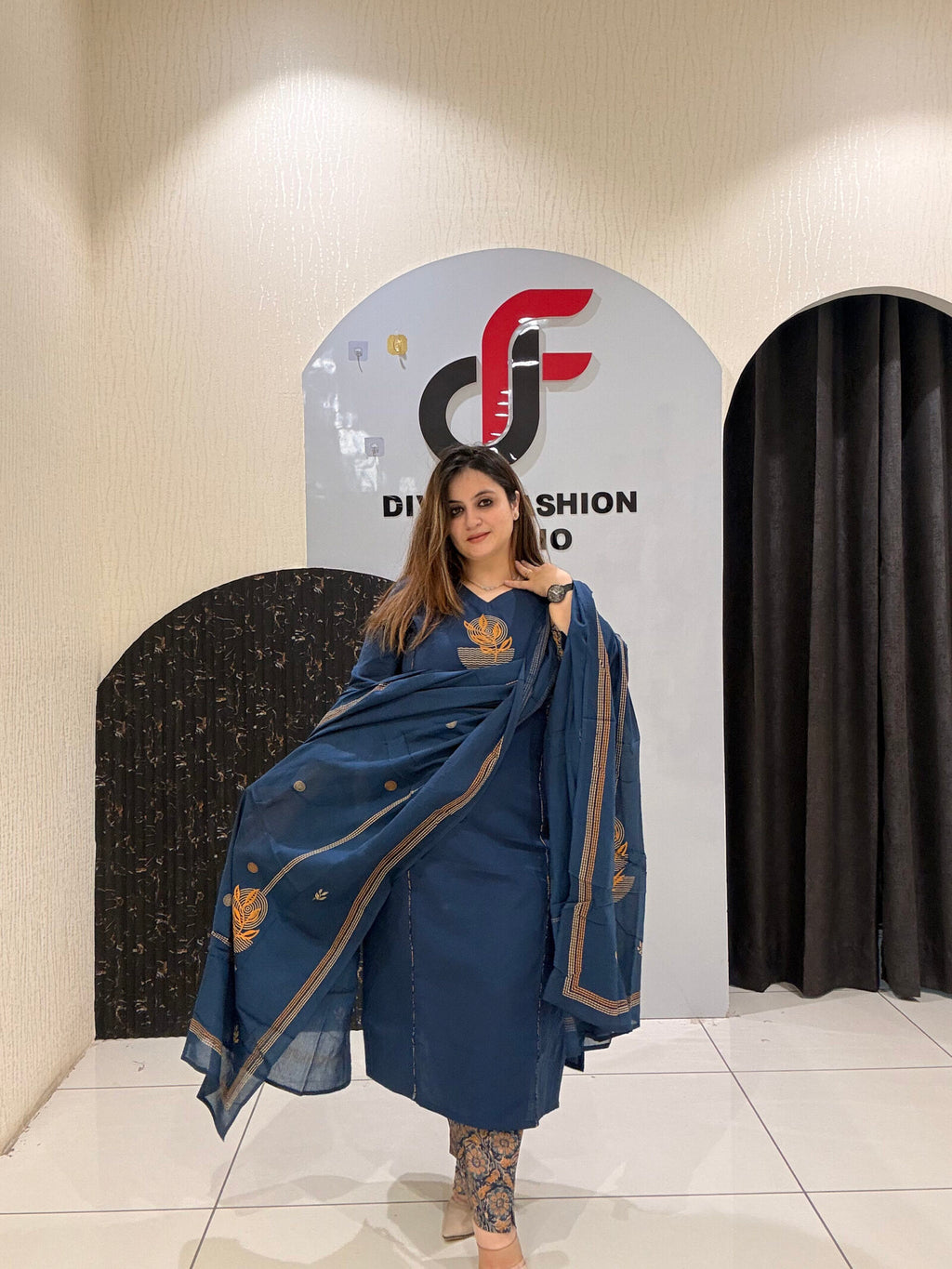 Classic navy blue cotton suit featuring golden embroidery and a matching dupatta with delicate border detailing
