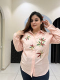 Chic pink linen cotton top featuring delicate leaf embroidery and a button-down design