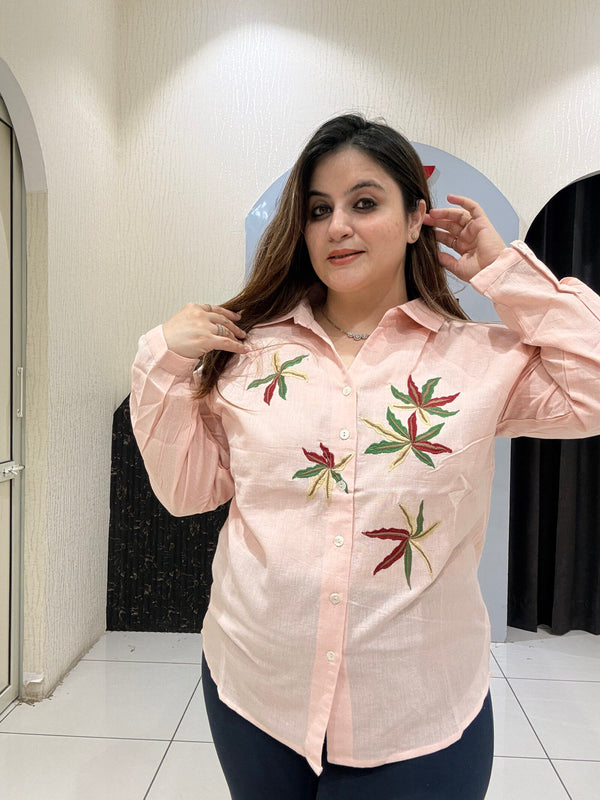 Chic pink linen cotton top featuring delicate leaf embroidery and a button-down design