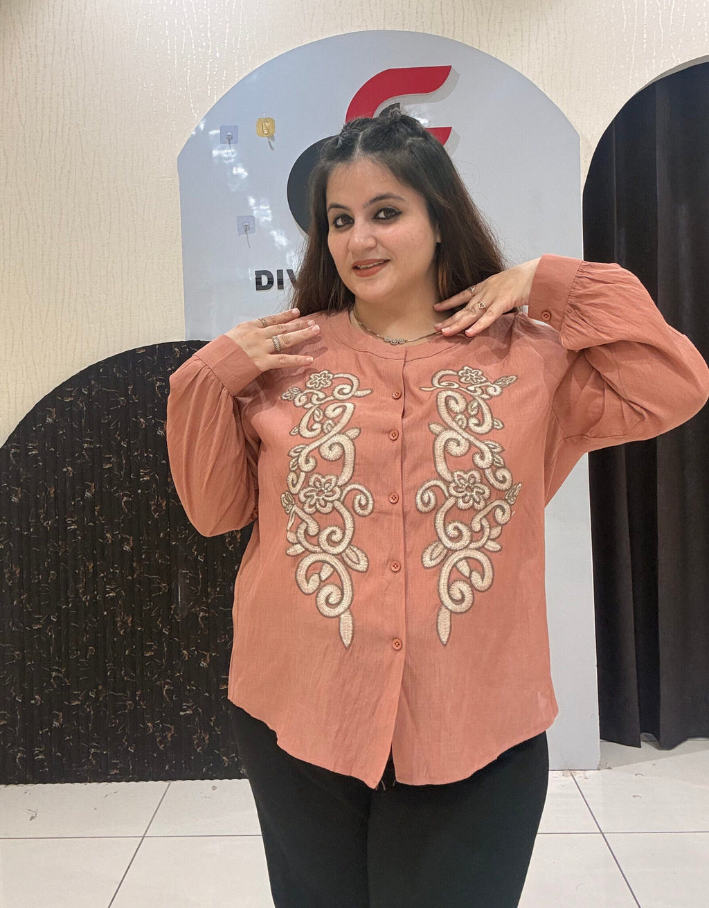 Stylish cotton tops featuring intricate front embroidery and a classic button-up design