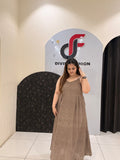 Stylish sleeveless cotton middi dress featuring delicate embroidery and a flowy silhouette