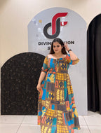 Eye-catching digital printed cotton middi featuring a mix of geometric and abstract patterns in rich hues of yellow, blue, and brown