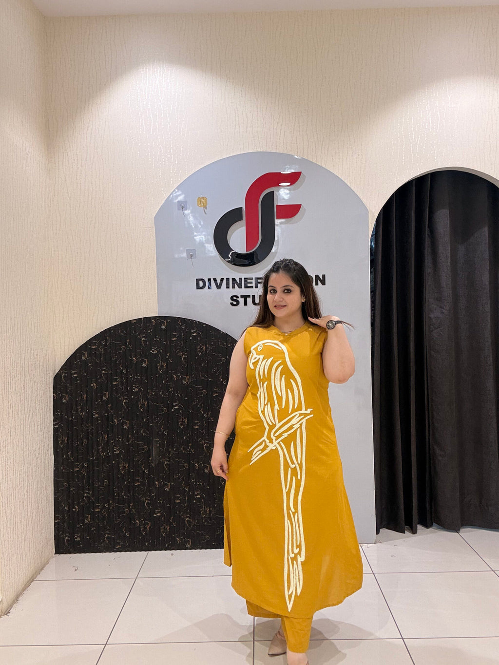 Stylish mustard cotton two-piece outfit featuring a striking parrot motif and matching pants