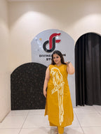 Stylish mustard cotton two-piece outfit featuring a striking parrot motif and matching pants