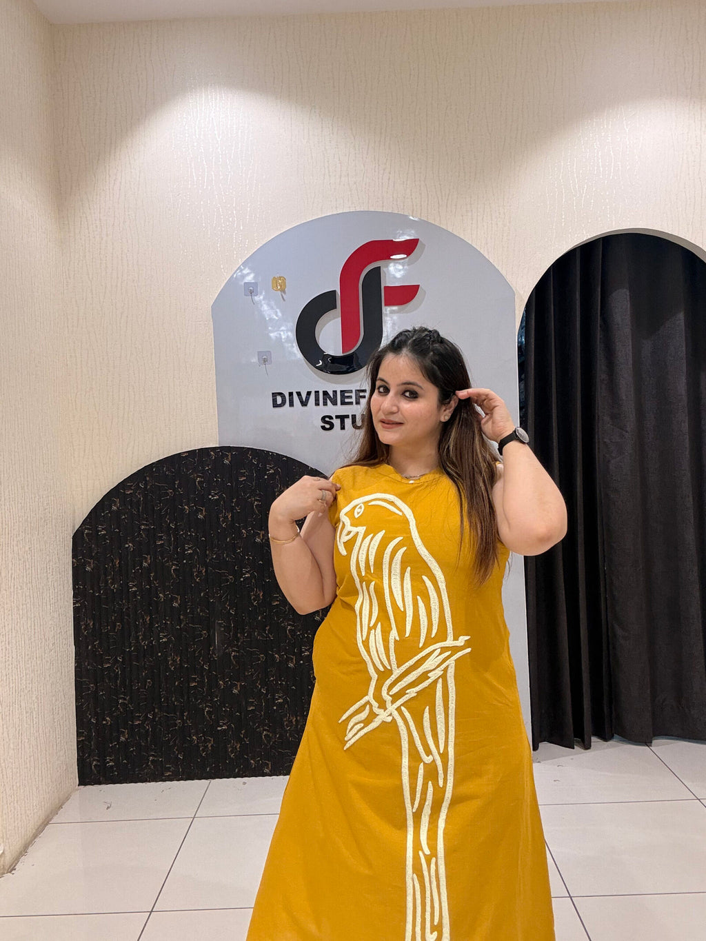 Stylish mustard cotton two-piece outfit featuring a striking parrot motif and matching pants