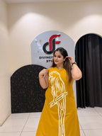 Stylish mustard cotton two-piece outfit featuring a striking parrot motif and matching pants