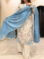 Graceful cotton Pakistani suit featuring delicate floral embroidery and a soothing blue dupatta