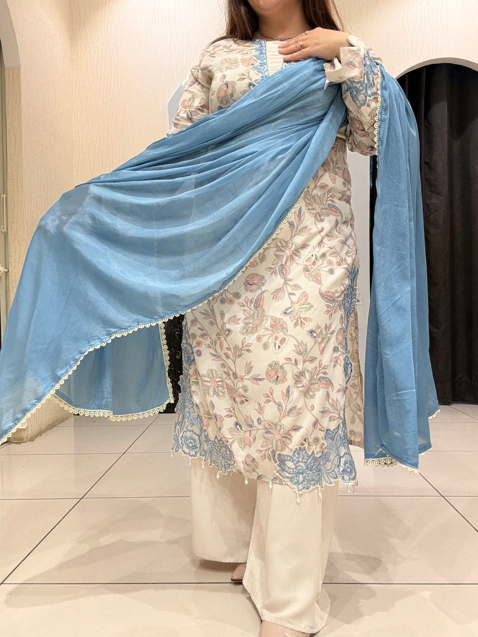 Graceful cotton Pakistani suit featuring delicate floral embroidery and a soothing blue dupatta