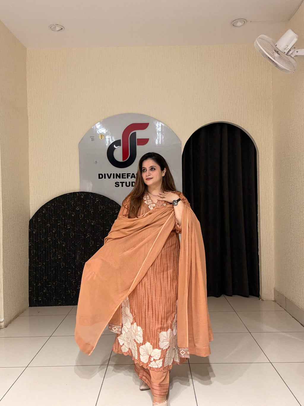 Graceful peach pure cotton suit featuring delicate white thread embroidery and a matching dupatta. Perfect for festive occasions, office wear, or elegant day outings
