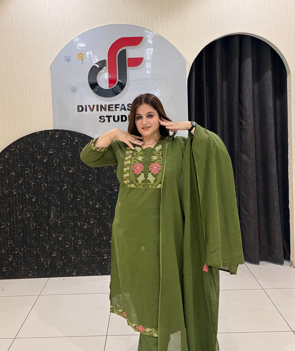 Graceful olive green pure cotton suit featuring delicate thread embroidery and a matching dupatta