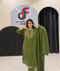 Graceful olive green pure cotton suit featuring delicate thread embroidery and a matching dupatta