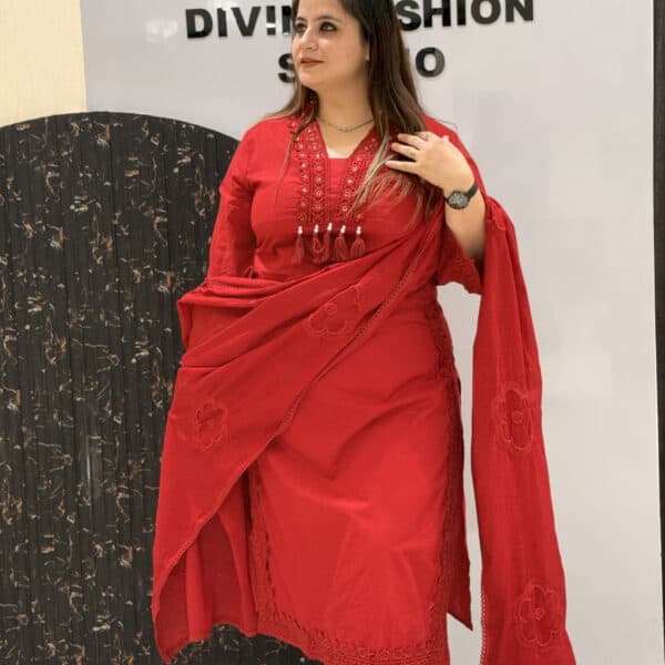 Elegant red cotton kurta set featuring intricate lace detailing and floral embroidery.