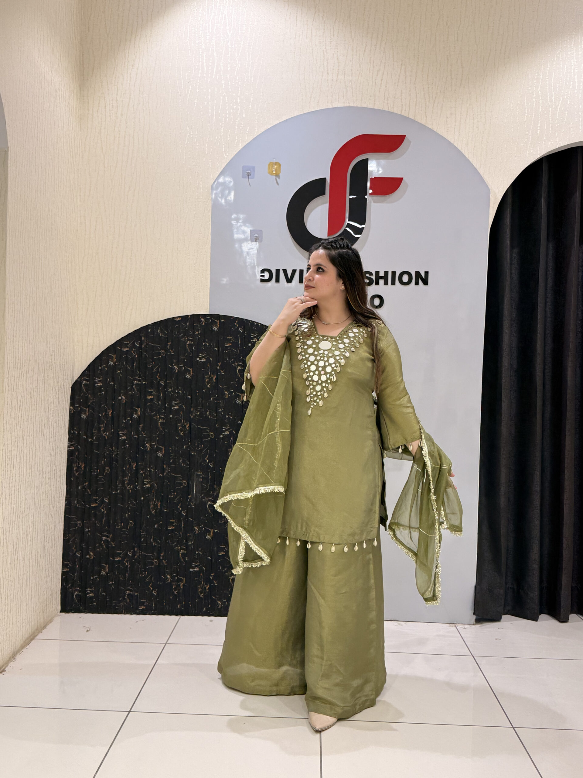 Woman in olive green co-ord set with floral embroidery and dupatta