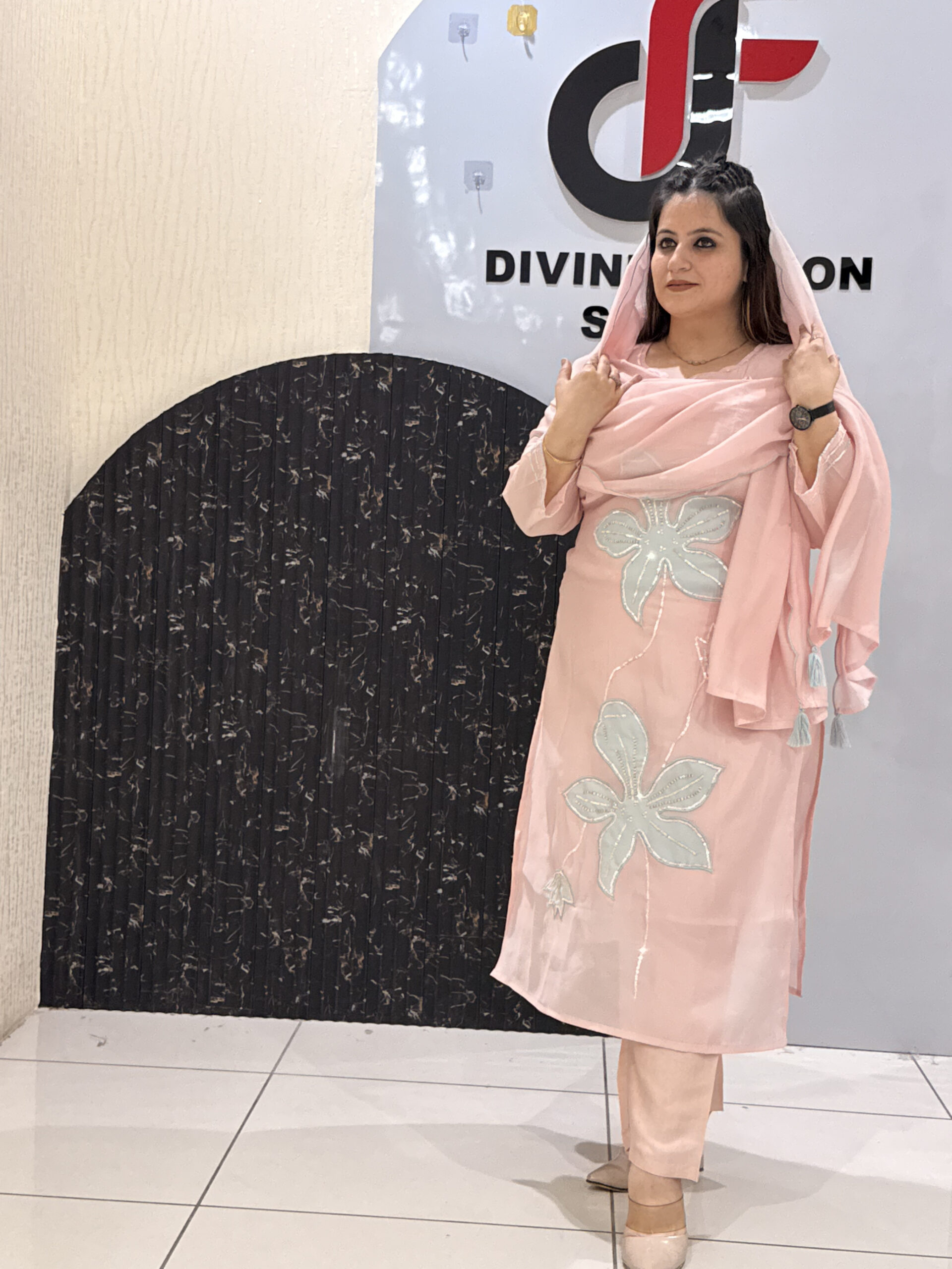 Woman in a pink floral embroidered button-down co-ord set with a dupatta