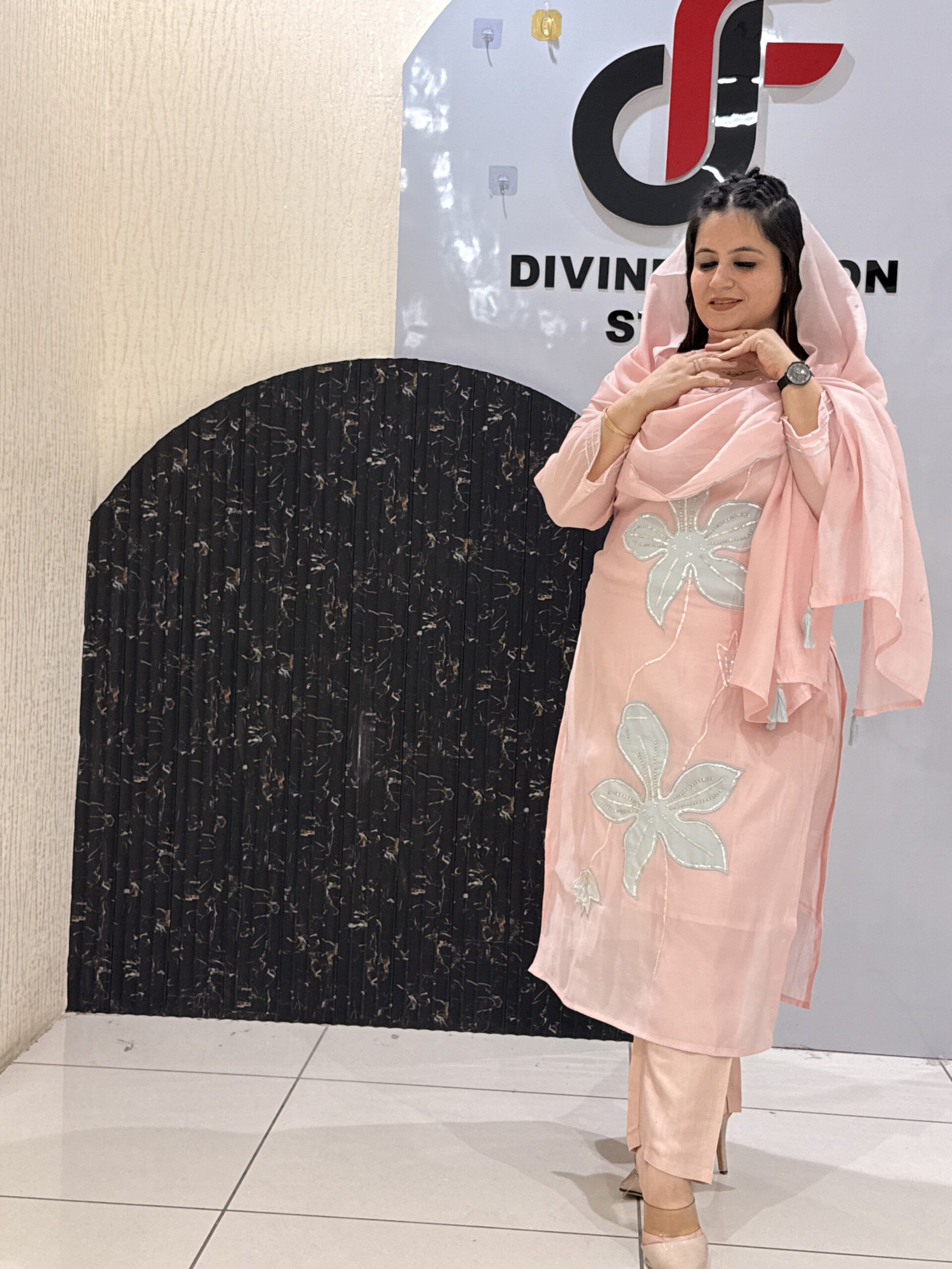Woman in a pink floral embroidered button-down co-ord set