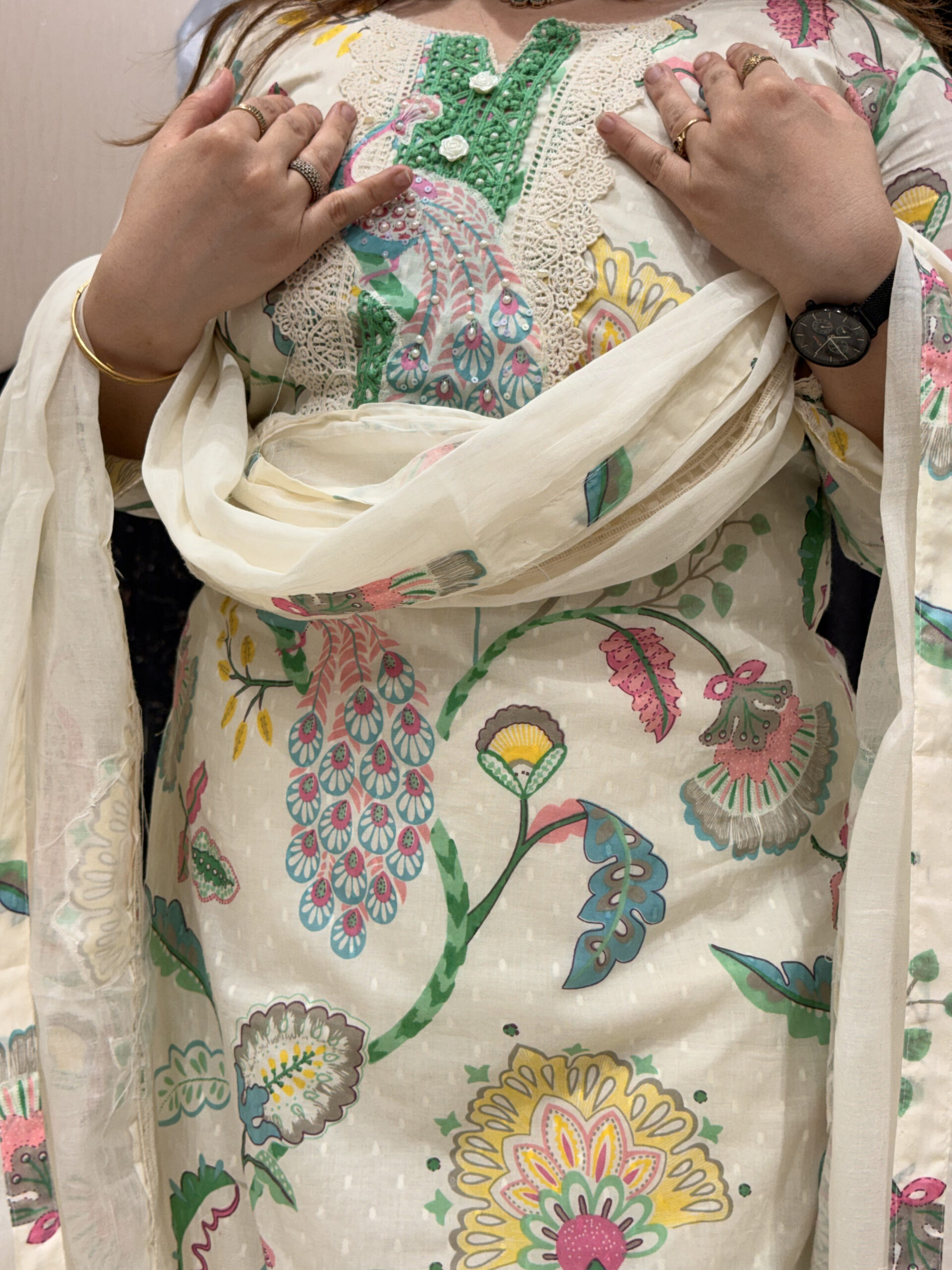 Woman wearing a floral embroidered button-down co-ord set with a dupatta