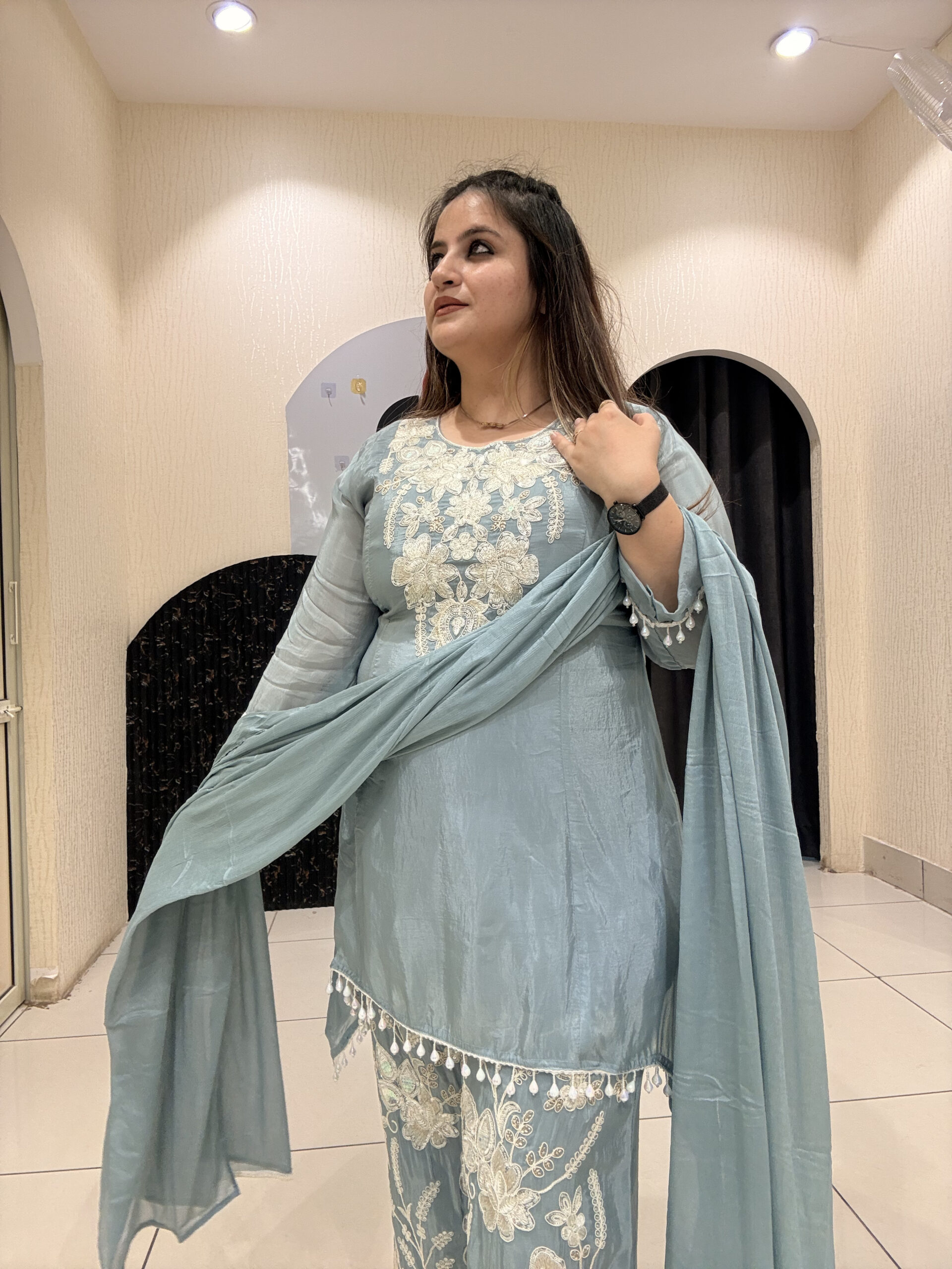Graceful pastel blue crepe suit set featuring intricate hand embroidery and matching dupatta
