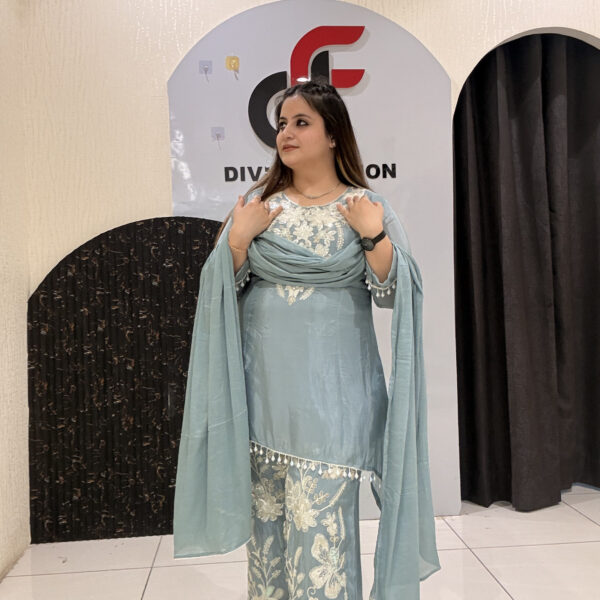 Graceful pastel blue crepe suit set featuring intricate hand embroidery and matching dupatta