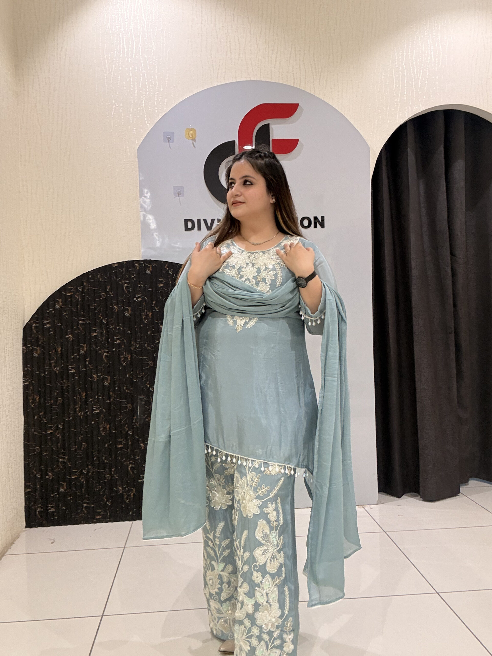Graceful pastel blue crepe suit set featuring intricate hand embroidery and matching dupatta