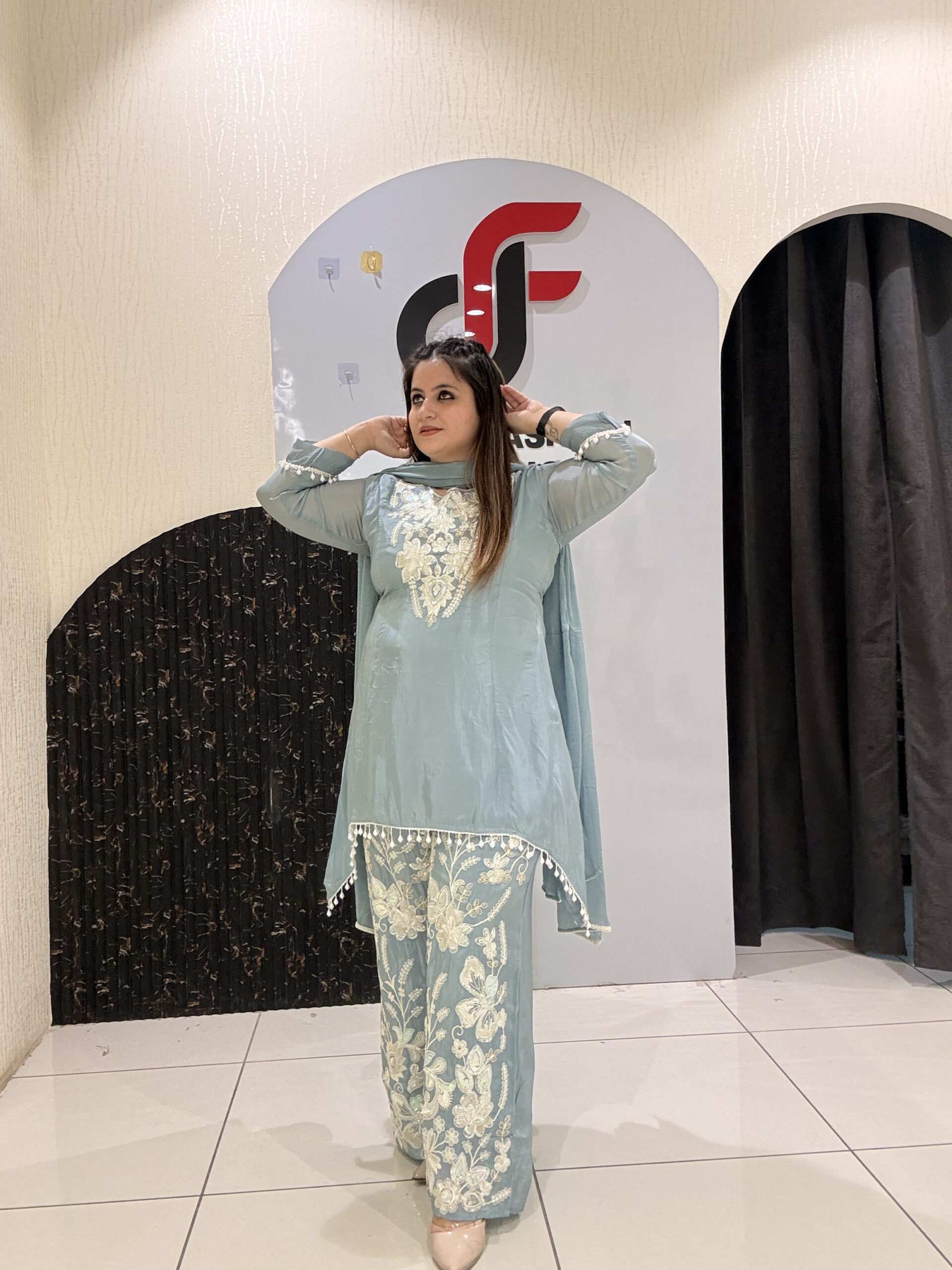Graceful pastel blue crepe suit set featuring intricate hand embroidery and matching dupatta