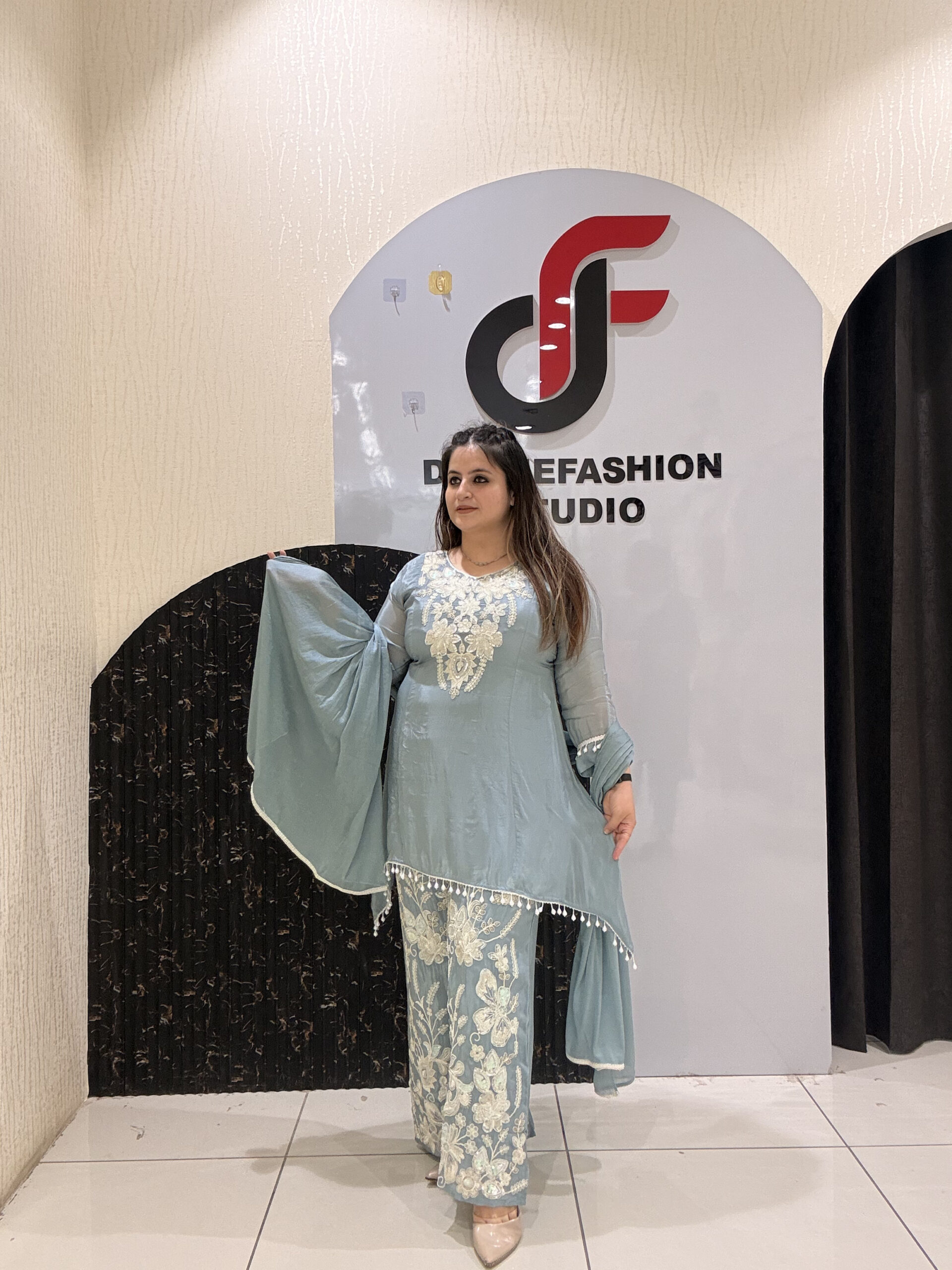 Graceful pastel blue crepe suit set featuring intricate hand embroidery and matching dupatta