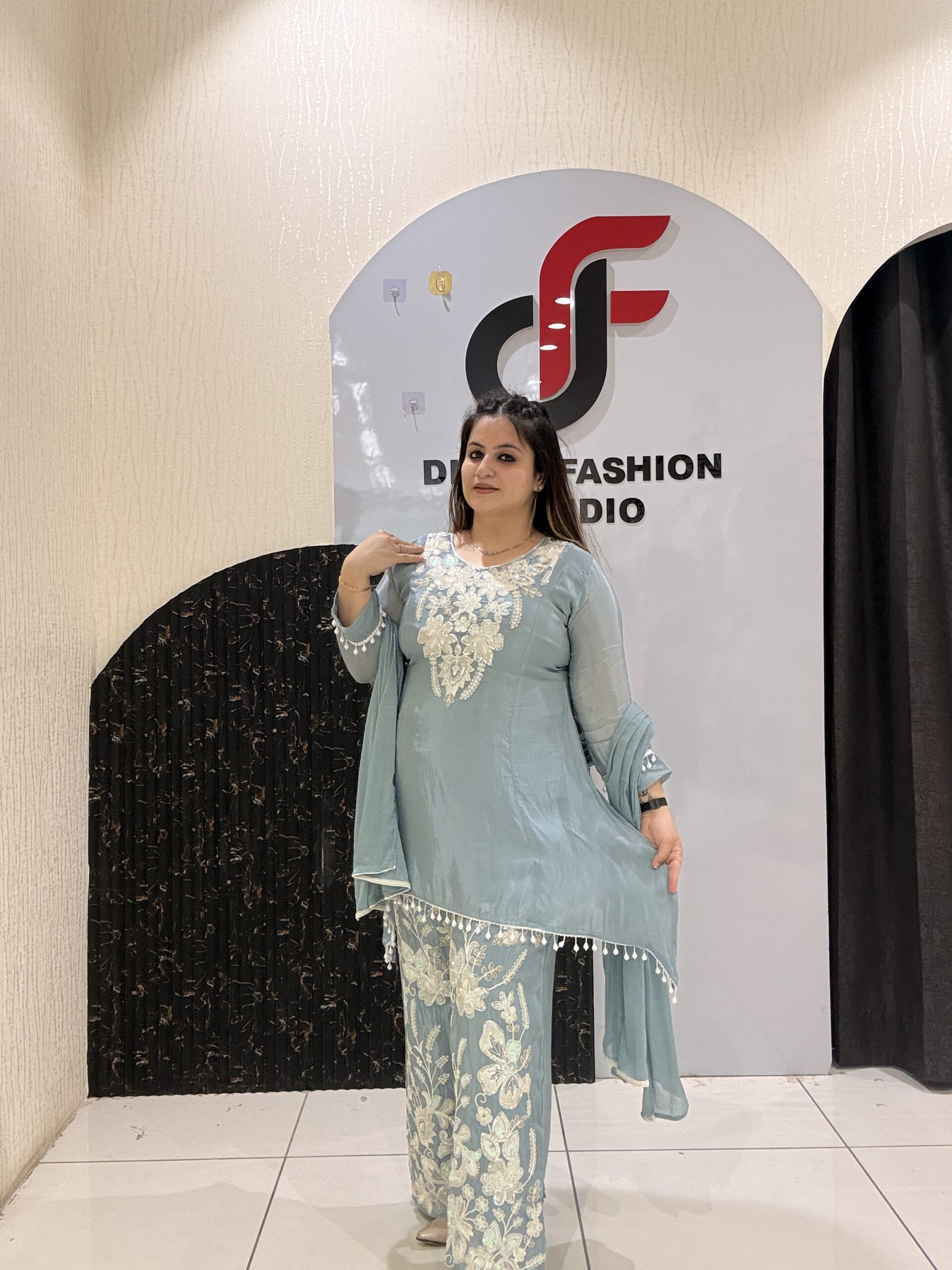 Graceful pastel blue crepe suit set featuring intricate hand embroidery and matching dupatta